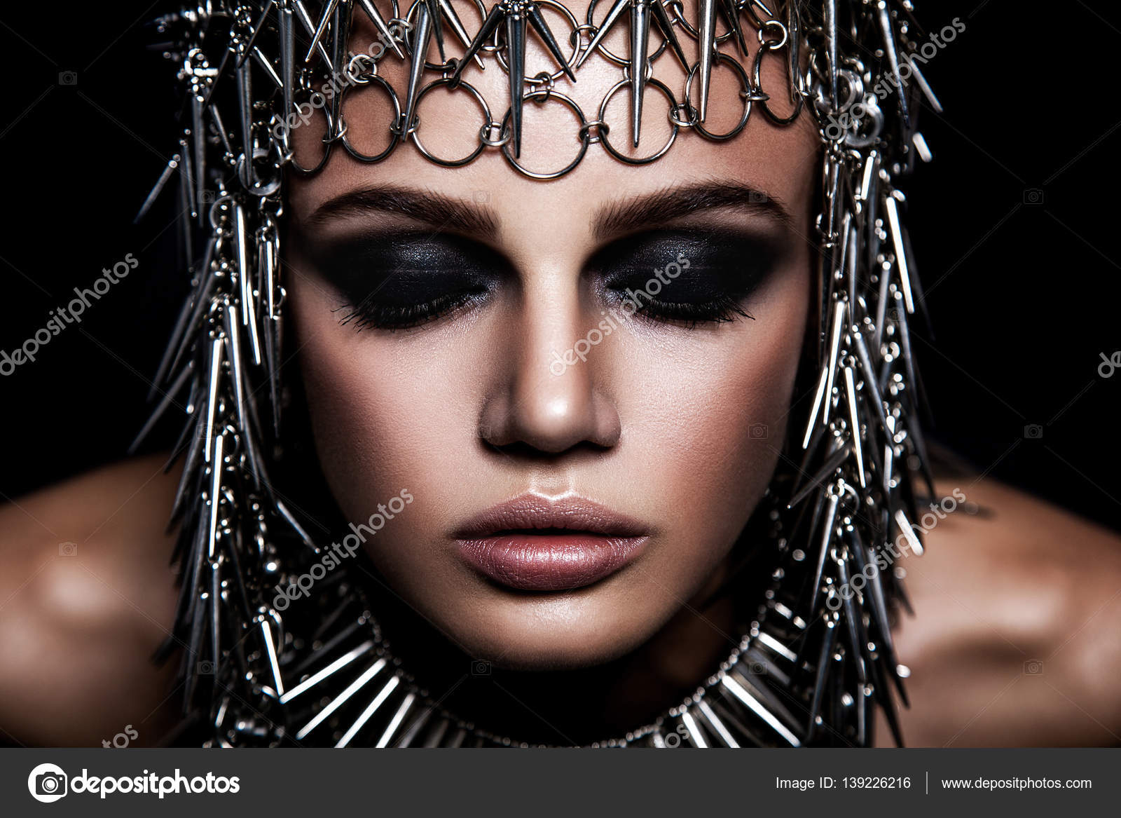 Blue Eyes Dark Makeup High Fashion Beauty Model With Metallic Headwear And Dark Makeup And