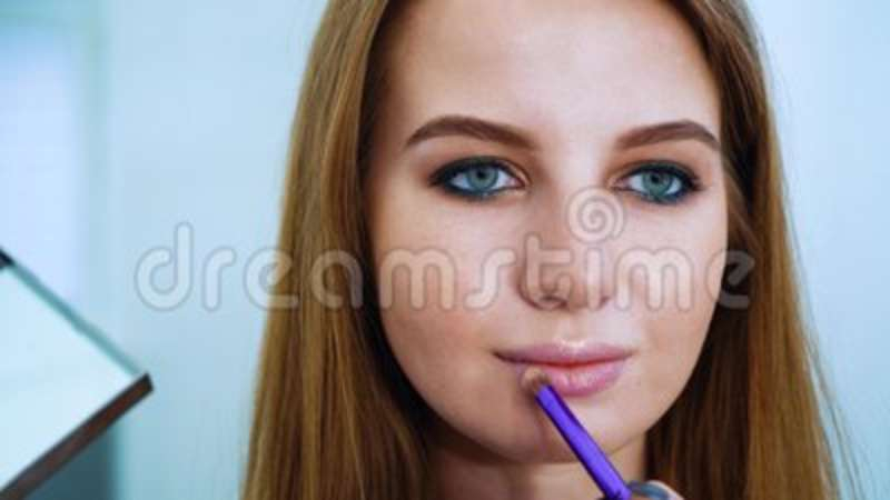 Red Hair Blue Eyes Makeup Closeup Young Blue Eyes And Red Hair Woman Getting Lip Gloss